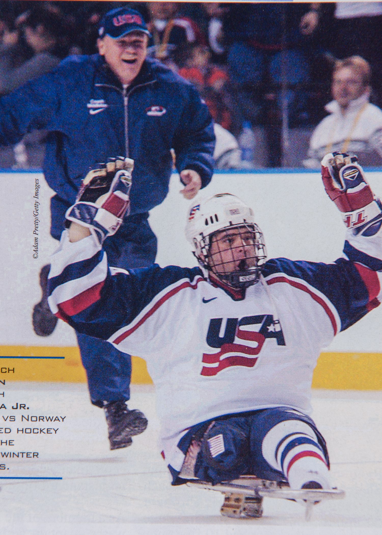 Rick Middleton crashes the ice after winning gold. 